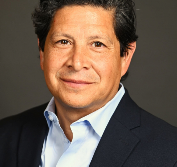 JAT headshot in suit tilted (002)